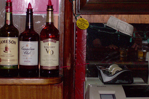 
                    The red straw indicates one of the many bullet holes at St Paul's Gopher Bar.
                                            (John Moe)
                                        