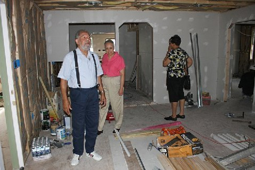 This is inside the home of Katrina survivor Edwin Harrison. He hopes to move back in within the month. The house is in New Orleans' 7th Ward. Along with Mr. Harrison are Sandra Peters in the pink shirt and Jaci Sturgies. Both are from Charlotte, North Carolina and were in town for the 30th Cooper Family Reunion.
(Curt Peters)