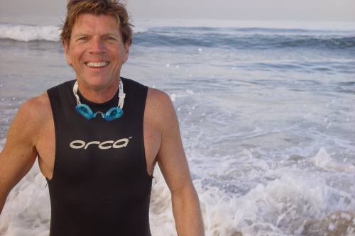 
                    Tim Bomba, triathlete, hangs out in the waves.
                                            (Paul Hekimian)
                                        
