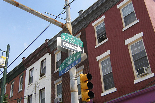 
                    Yong Lee's memorial is right outside of his store at the corner of 28th St. and Girard Ave. in Philly.
                                            (Jonathan Menjivar)
                                        