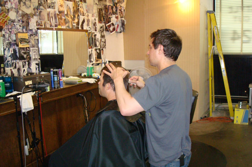 
                    At Rudy's Barbershop, customers don't need to flip through magazines to find a hairstyle they like. All they have to do is look on the wall.
                                            (Tim Bomba)
                                        