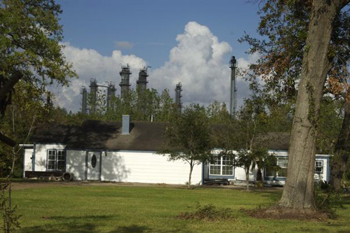 
                    A home on the fence line of the Houston Ship Channel.
                                            (Michael May)
                                        