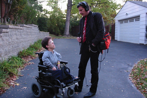 
                    Reporter Rick Karr and Sarah Coyle wait for the Call-A-Ride bus.
                                            (Kristina Cafarella)
                                        