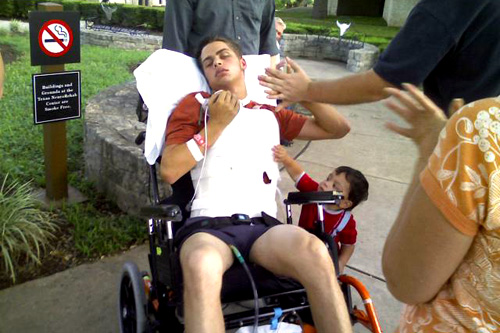 
                    Justin Logan with his son Michael, at the Texas NeuroRehab Center
                                            (Danette Overstreet)
                                        