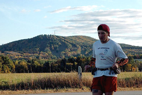 John Lacroix is running across the state of New Hampshire with his friend Nate Sanel. If one runner feels particularly good or bad, they'll separate and reconnect up the road. Here, John goes off on his own for a stretch.
(Sarah Chretien)