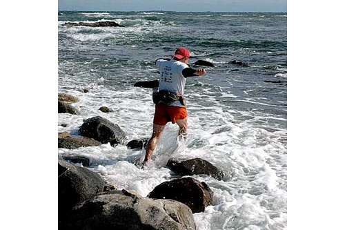 
                    John isn't ready to stop yet.  The cold, cold sea is inviting and he races out into the water.
                                            (Sarah Chretien)
                                        