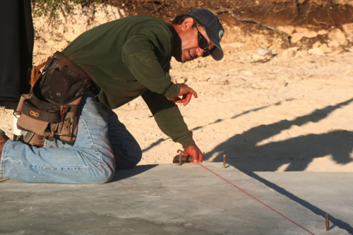
                    Ramiro Mora snaps a chalk line.
                                            (Michael May)
                                        