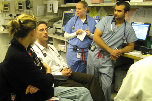 At the end of the Friday night shift, the doctors and interns and residents 'pass off' to the overnight shift. They go over each patient and discuss how they've cared for each patient in ER care.
(Curt Nickisch)