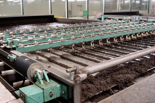 
                    The finest of several sewage screens designed to take garbage and grit out of the sewage.  Solids are either composted, turned into fertilizer, or taken to a landfill.
                                            (Joshua McNichols)
                                        