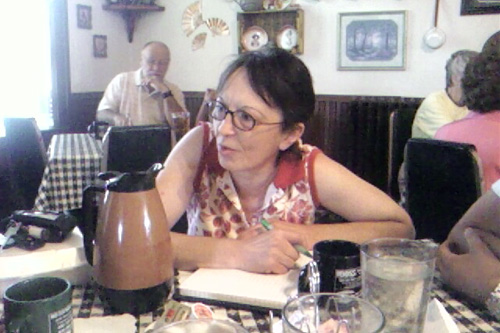 
                    Lori writes her message to the President during breakfast with BJ at "The Hotel" in Scribner, Nebraska.
                                            (BJ Hill)
                                        