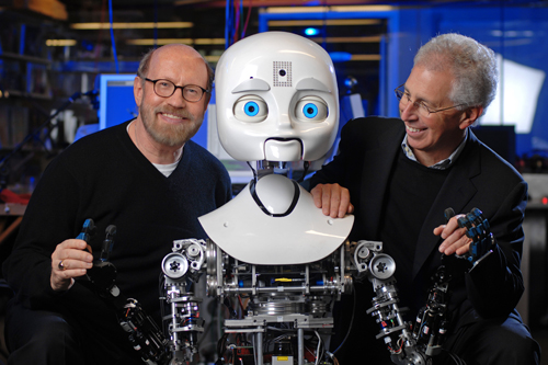 
                    David Kirkpatrick and Frank Moss, director of the MIT Media Lab, with Nexi.
                                            (Sam Ogden)
                                        